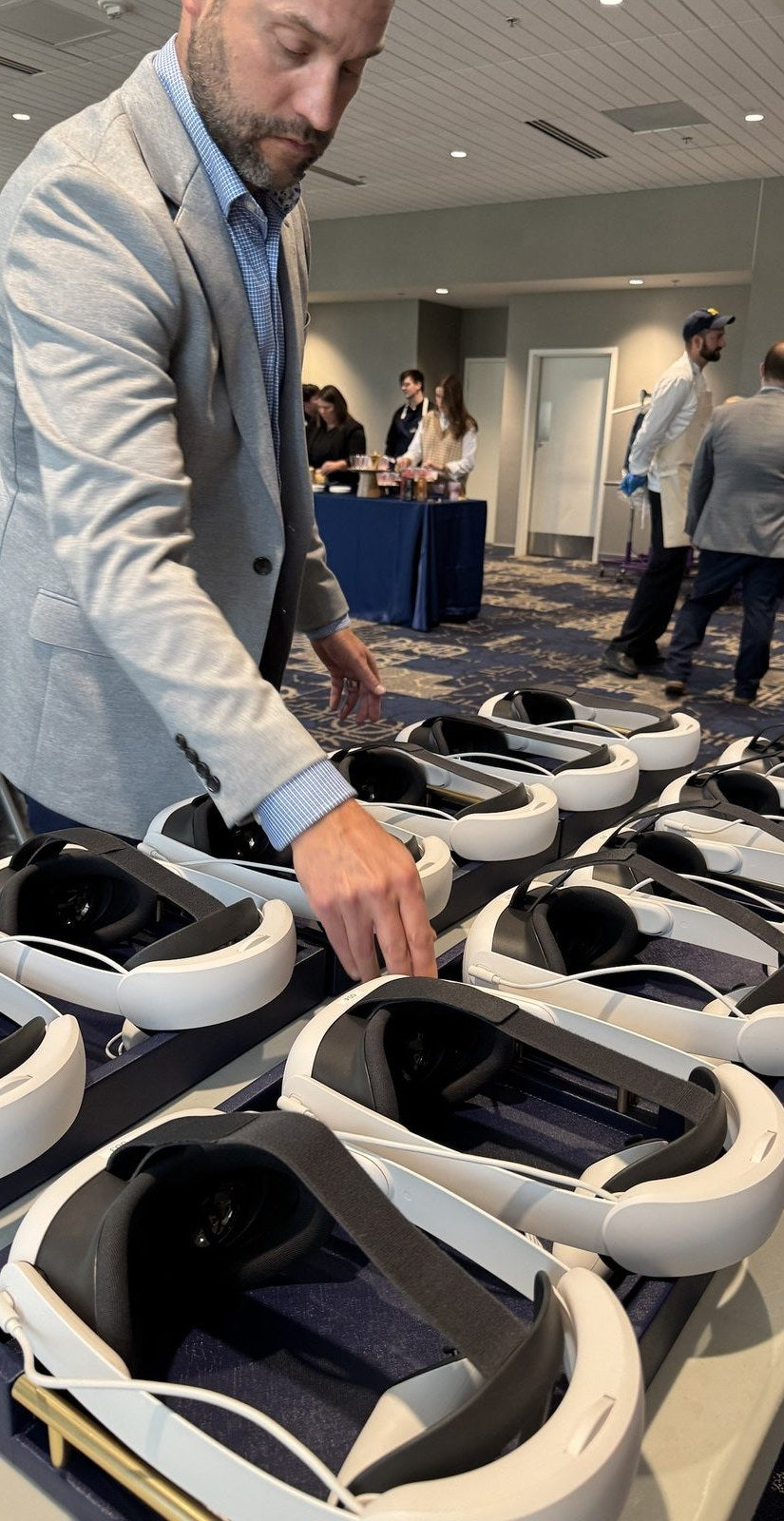 Headsets laid out on a table at an event