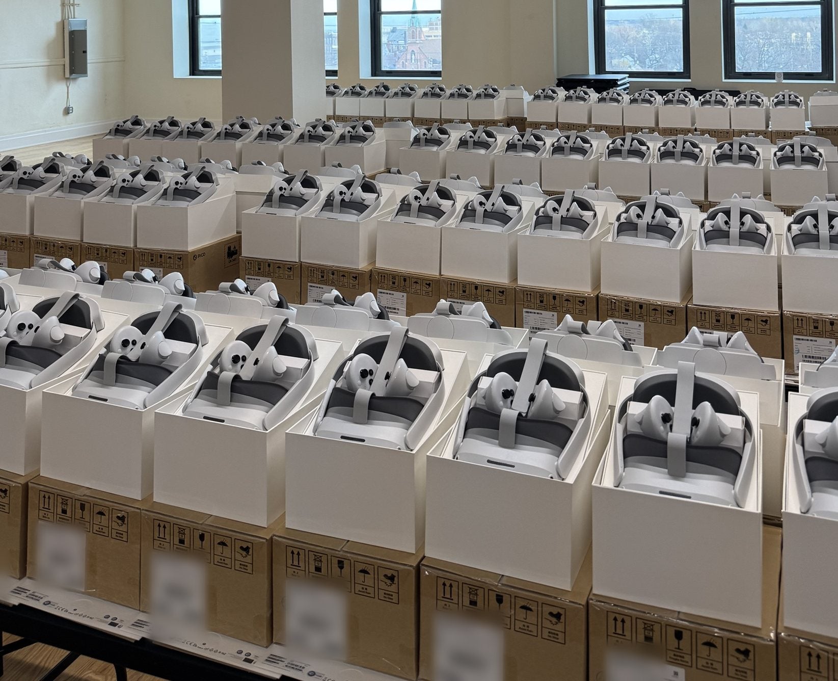 Rows of headsets in open boxes in the Channel XR operations center, Cleveland, Ohio